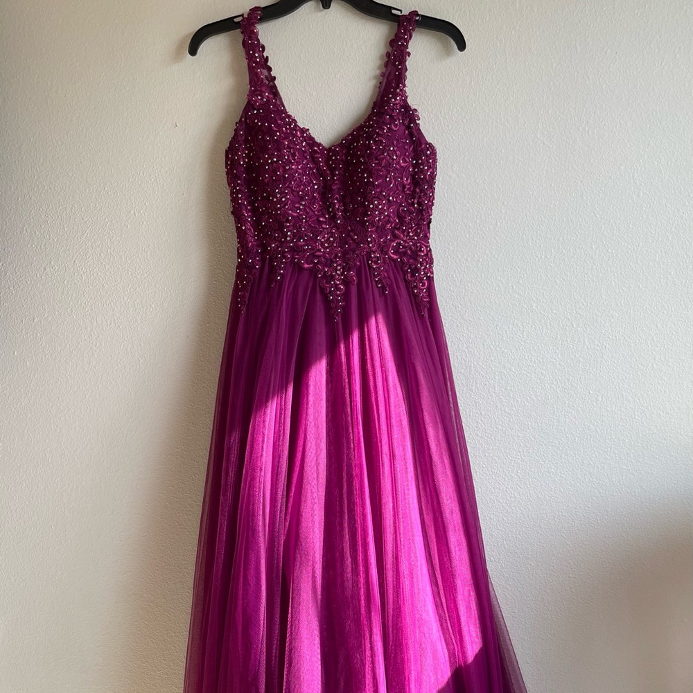 Purple/pink floor length gown.